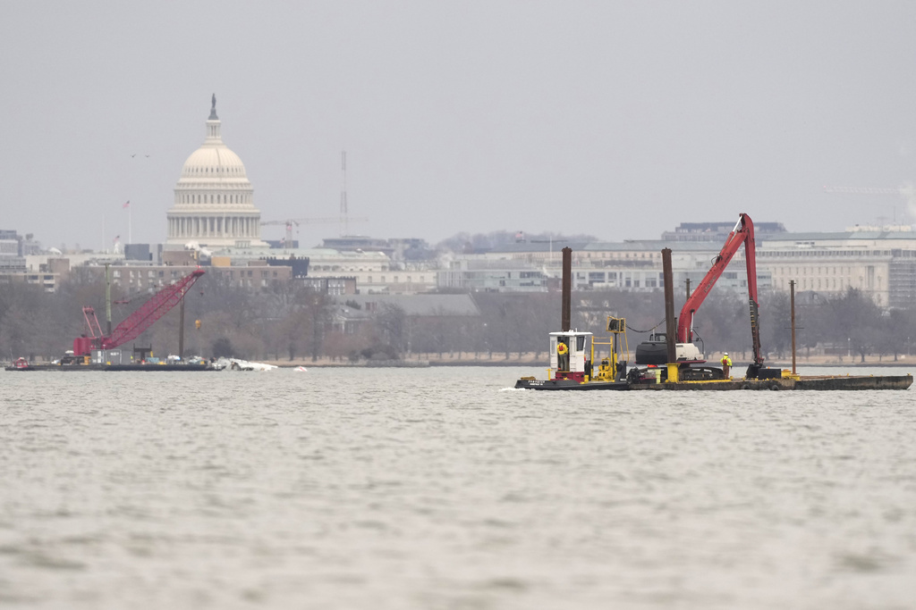 Crews return to the Potomac River to recover wreckage from DC midair collision