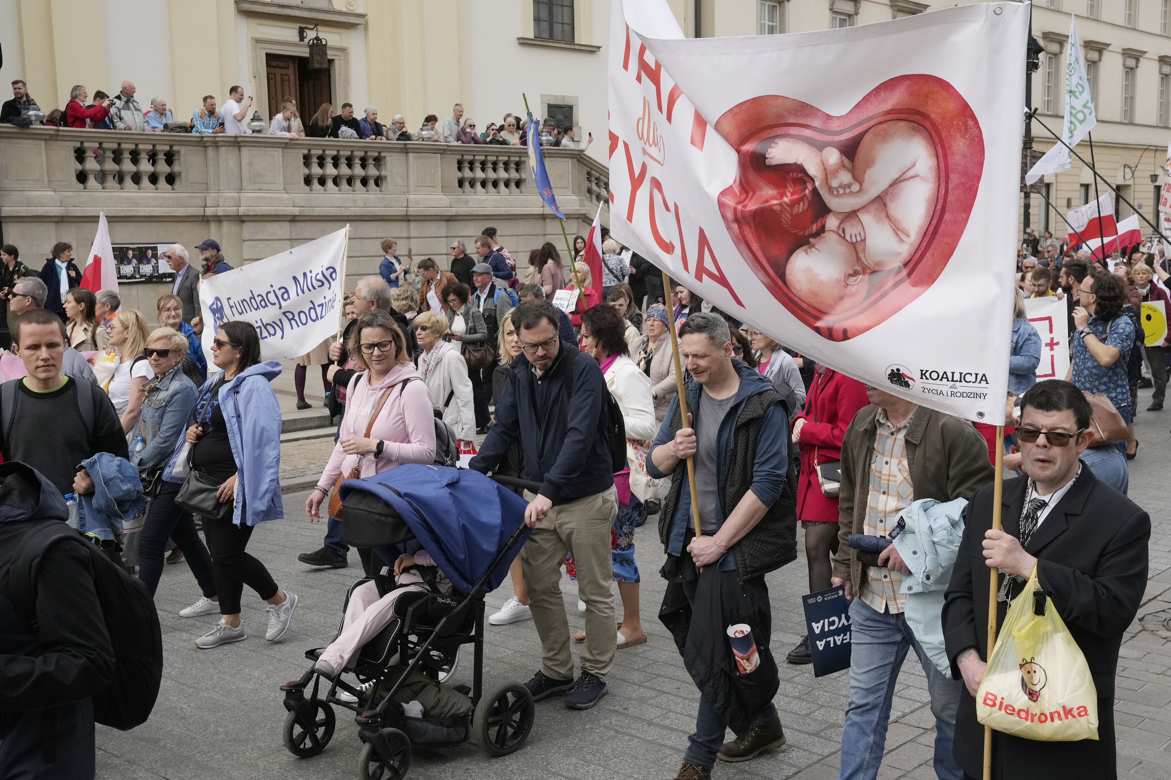 Polish opponents of abortion march against recent steps to liberalize strict law