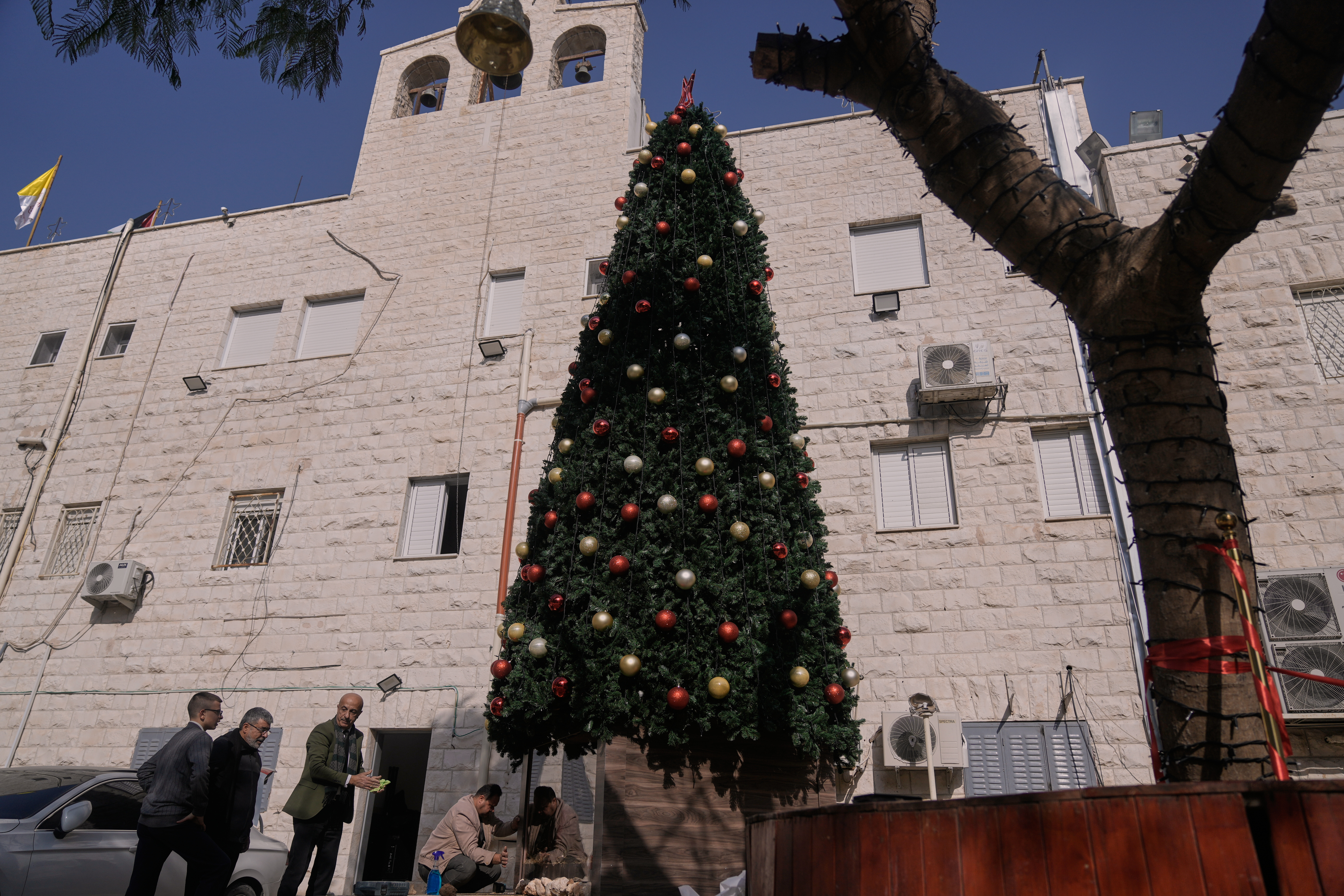 3 Palestinians arrested on suspicion of torching a Christmas tree at a Catholic church in West Bank