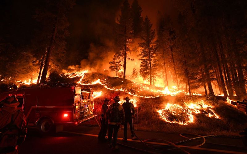 Thousands evacuated as wildfires burn across western US and Canada