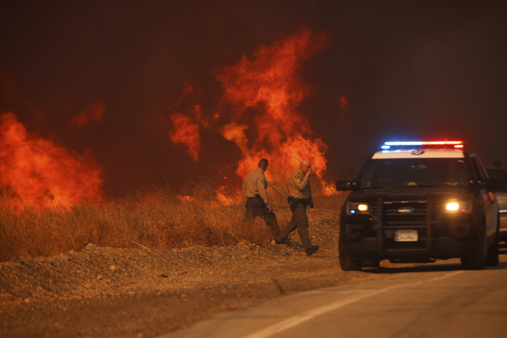 Firefighters battle to maintain the upper hand on a huge fire north of Los Angeles