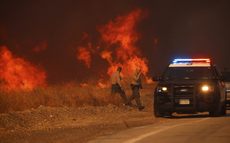 Firefighters battle to maintain the upper hand on a huge fire north of Los Angeles