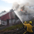 Coastal homes burn as hot winds fuel California fires