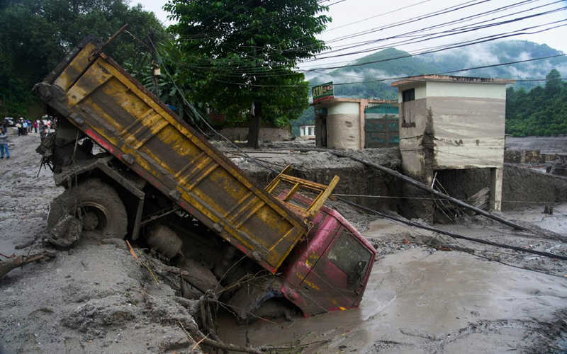 Death toll climbs and hundreds are missing in wake of glacier collapse in Nepal
