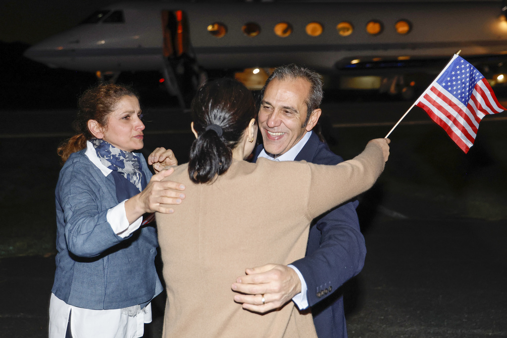 Americans released by Iran arrive home