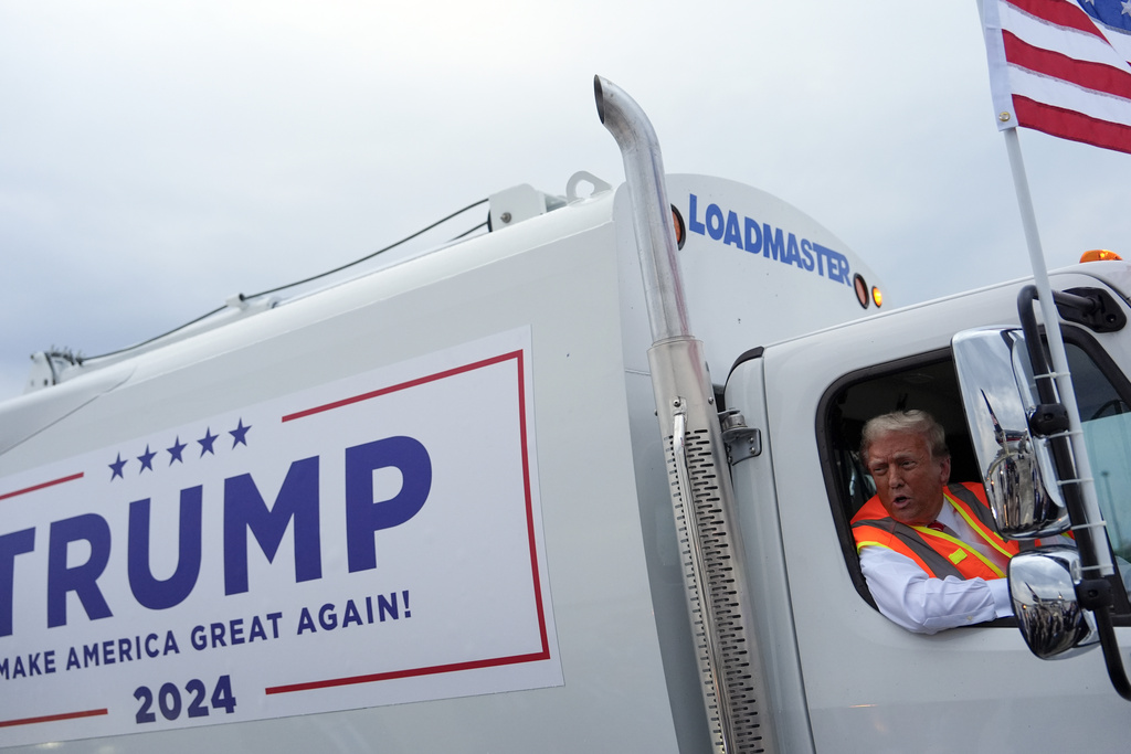 Trump boards a garbage truck to draw attention to Biden remark