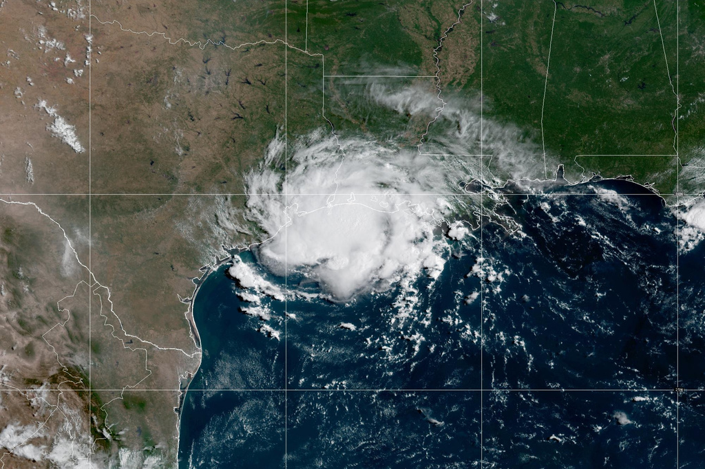 Edouard weakens into a tropical depression but still dumping rain into Texas