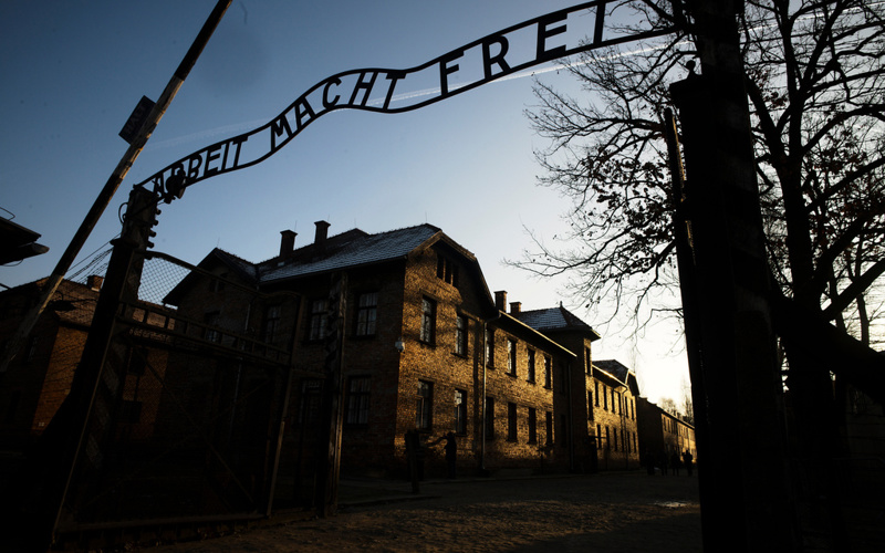 Faith leaders condemn Catholic school's Halloween float that included Auschwitz sign