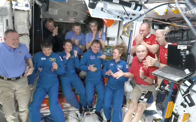 NASA's stuck astronauts welcome their newly arrived replacements to the space station