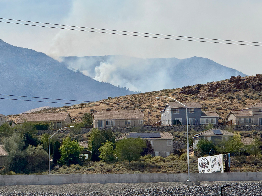 Thousands evacuated as fast-moving wildfire threatens Reno, Nevada
