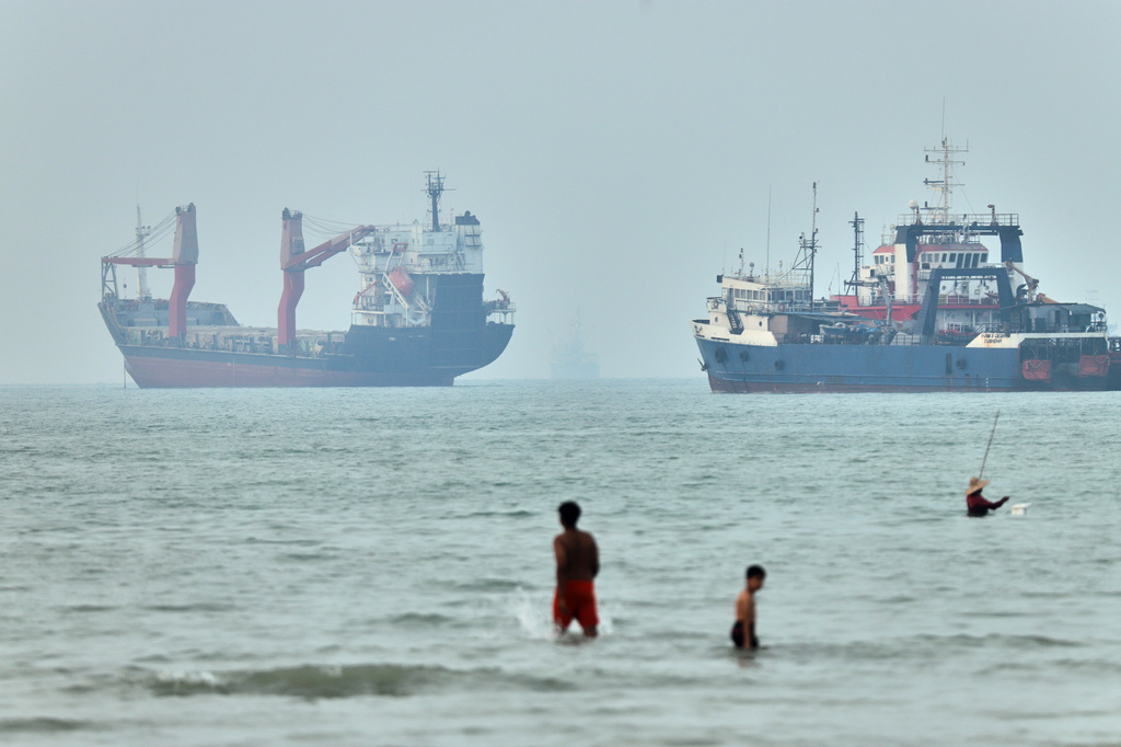 Cargo ship reports being struck in Strait of Hormuz
