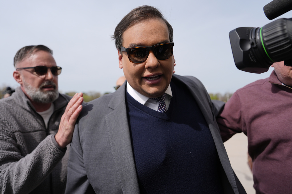 Former congressman Santos sentenced to over 7 years in prison for fraud and identity theft