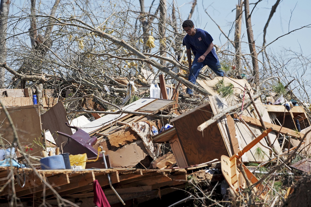 Death toll from weekend storms continues to climb