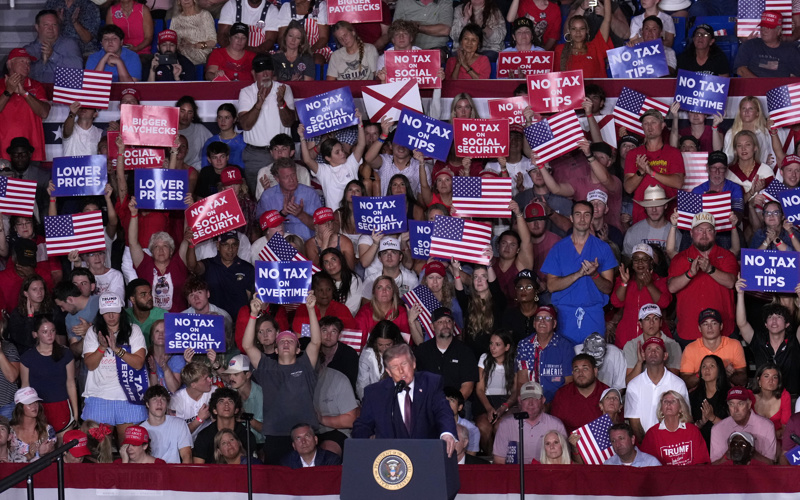 Trump stumps for candidates in deep red Alabama and says he'll be back again next week