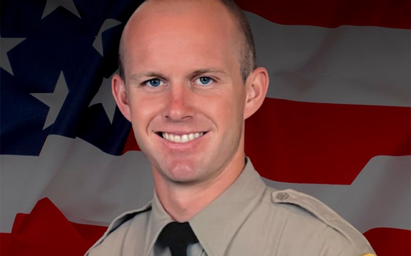 Los Angeles County sheriff's deputy dies after being shot in his patrol car by an unknown assailant