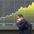 World shares decline, while oil pops above $100 a barrel over Iran war worries