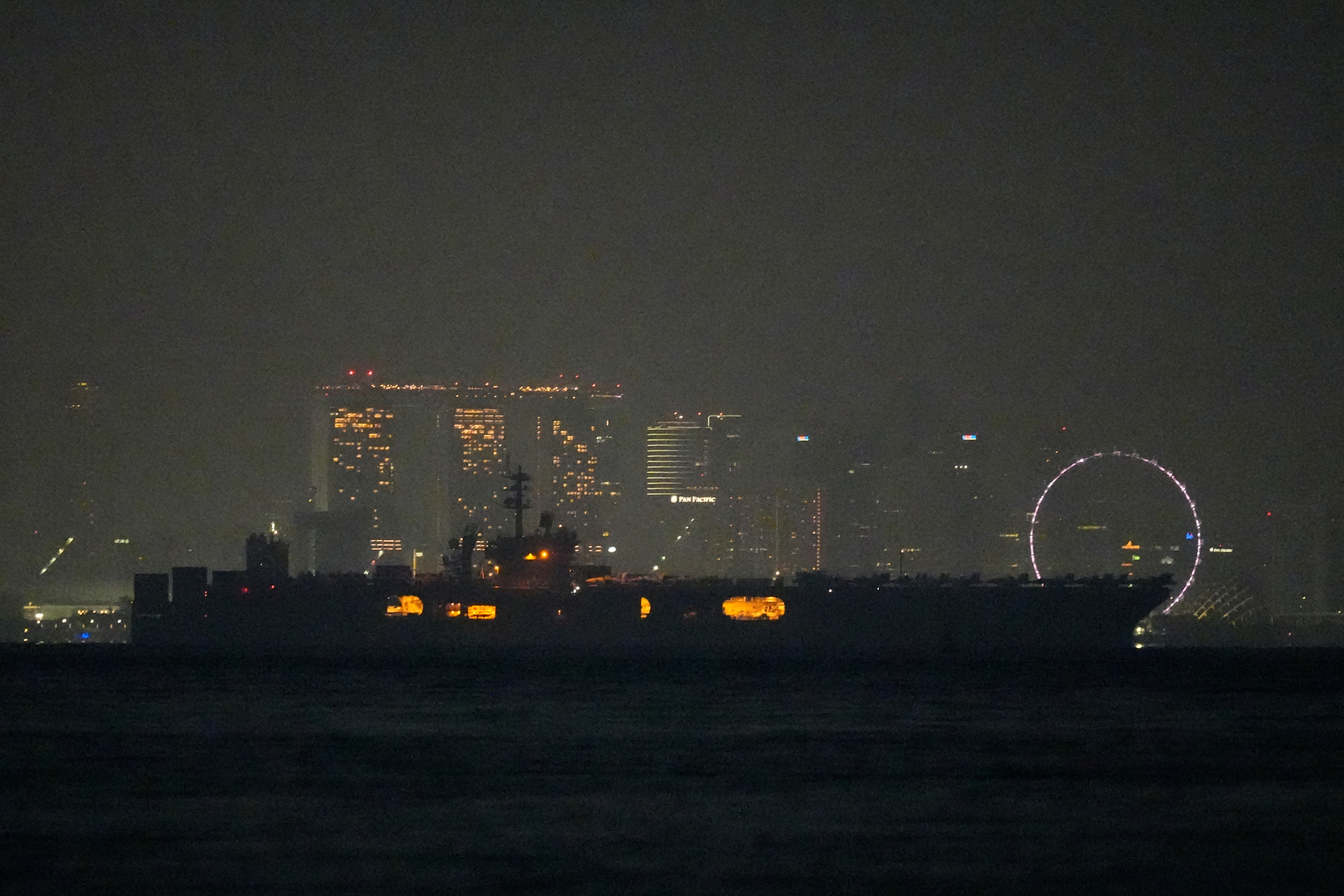 USS Abraham Lincoln sails past Singapore on its way home from Middle East